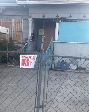 Photo of boarded up home, courtesy of Xennia Hamilton
