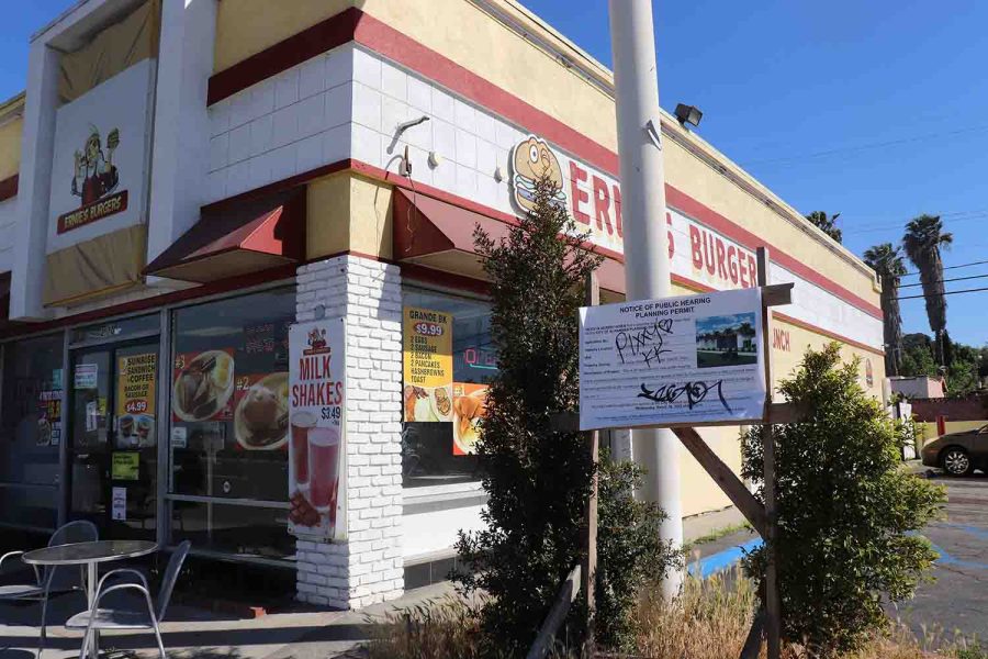 A building selling burgers to people.